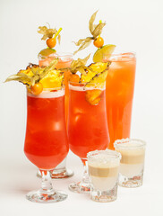 Delicious coctails, longs and shots in glass on white background