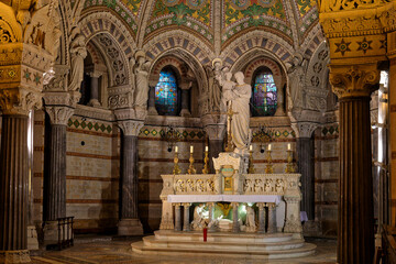 Fototapeta na wymiar LYON, FRANCE, November 8, 2022 : Inside the crypt of Fourvière Basilica. Lyon commemorates the 150th anniversary of the laying of the foundation stone of basilica.