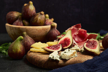 still life fruits figs cheese and jamon