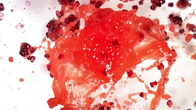 Slow Motion of Explosion Pomegranate Seeds and Burst Red Juice