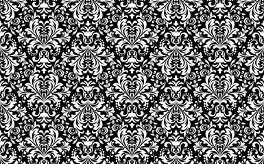 Wallpaper in the style of Baroque. Seamless vector background. White and black floral ornament. Graphic pattern for fabric, wallpaper, packaging. Ornate Damask flower ornament