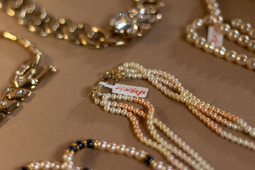 Retro jewelry at the vintage market. Close up.