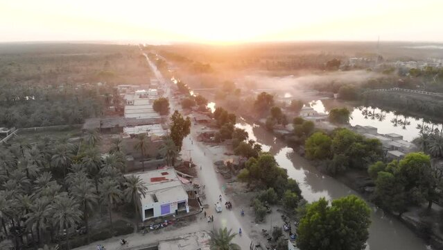 Aerial shot of rural life in Pakistan in a bright morning.