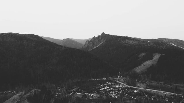 on the fly rocks and hills in black and white
