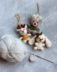 Colorful crochet toys close up photo. Hand made Christmas tree decorations. Cute amigurumi toys. 