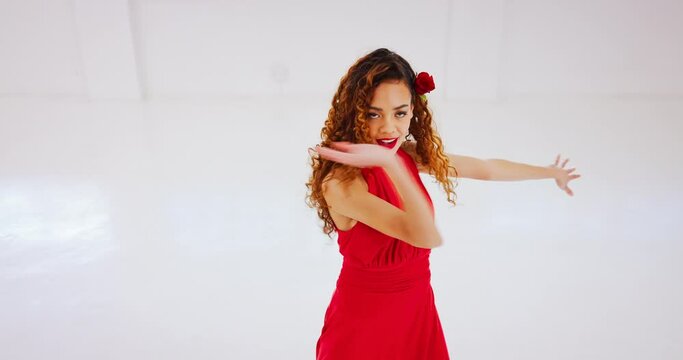Salsa dancer, ballroom performance and woman in red dress dancing with energy, freedom and music in studio theatre. Portrait artist in flamenco, tango and samba performance of musical creative class