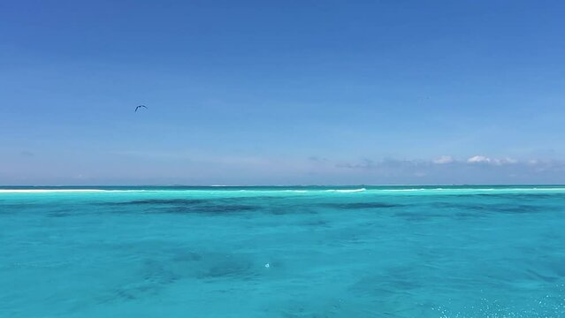 POV sail on turquoise caribbean sea waves ans splash  texture sea water.