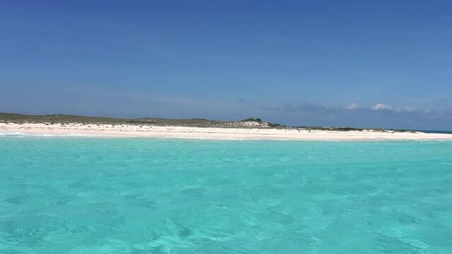 POV sailing toward white sandbank on caribbean turquoise sea water, Los Roques