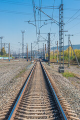 Fototapeta na wymiar Railway tracks leading to the station