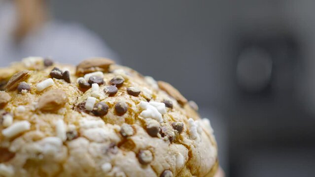 Traditional Italian homemade Christmas panettone typical of Milan with almonds, chocolate drops and sugar