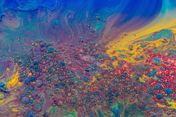 Obraz na płótnie Canvas Multicolored paints create a beautiful abstract background