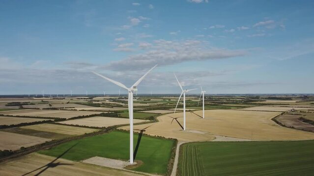 Wind Turbines Generating Alternative Energy At Wind Farm In Thisted, Denmark. aerial parallax