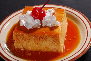 Mexican flan with cream and cherry. Flan