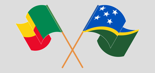 Crossed and waving flags of Benin and Solomon Islands