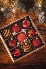 Christmas red ornaments on the wooden background