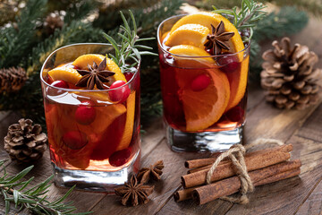 Mulled wine with orange slices, cranberries and spices