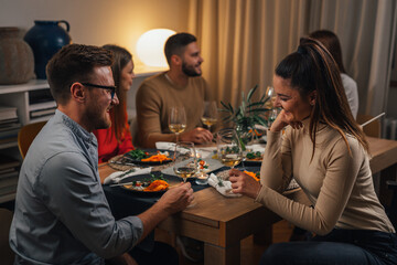 friends talking at home dinner party