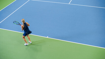 Female Tennis Player Just Served by Hitting Ball with a Racquet During Championship Match. Professional Woman Athlete Successfully Strikes. World Sports Tournament. High Angle Wide Shot.