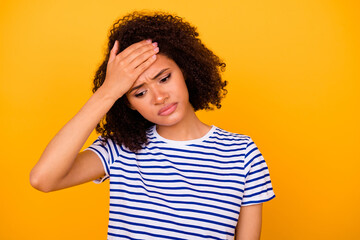 Photo of unhappy sad upset lady wear white t-shirt arm forehead isolated yellow color background