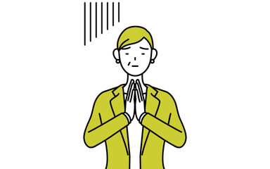 体の前で手を合わせて謝るスーツ姿のシニア女性、女性管理職・キャリアウーマン