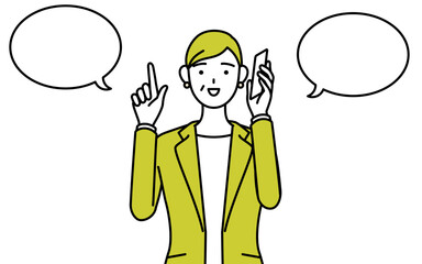 電話をしながら指さしをするスーツ姿のシニア女性、女性管理職・キャリアウーマン