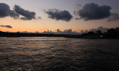 Naklejka premium Orange sky at sunset in the evening. Seascape overlooking the coast of Turkey on a summer day.