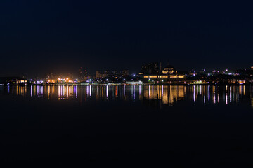 Night sky and light over the sea. Silhouette of the city of Istanbul.