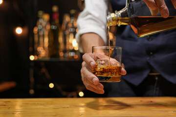 Bartender pouring Whiskey, on  bar,