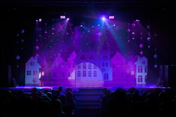 Fototapeta premium The stage of the theater illuminated by spotlights from the auditorium