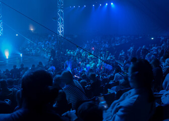 A circus hall full of audience waiting for the performance.