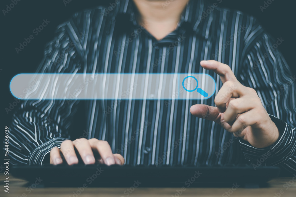 Wall mural search engine optimization concept man's hand using a computer to search for information on the inte