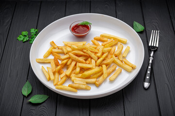 Appetizing side dish - French fries with ketchup in a white plate