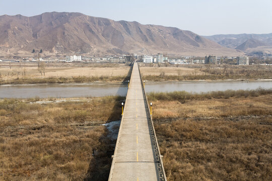 TUMEN, JILIN PROVINCE, CHINA - April 2008: road bridge to Namyang, in North Korea, border crossing for vehicles, Yanbian Korean Autonomous Prefecture, home to an important community of Korean origins