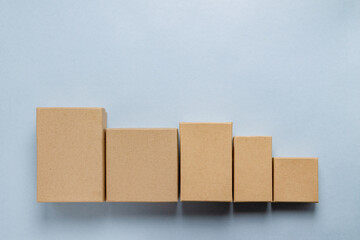 cardboard rectangular boxes on blue background, copy space, boxing day