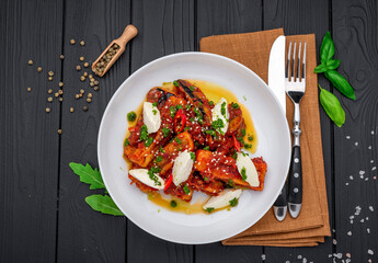 Fried eggplant slices in spicy tomato sauce with cream cheese.