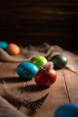 colorful rainbow Easter eggs on a wooden background