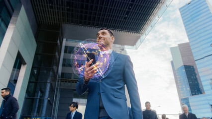 Handsome Businessman Uses New Smartphone with Visual Infographics Showing Internet Icons, Walks through Crowded Megapolis City Streets. Connection, Big Data, Information, e-Business Concept.