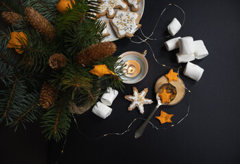Attributes of Christmas - marshmallows, homemade pastries, Christmas tree and garlands, atmosphere