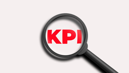 KPI word lettering typography with magnifying glass zooming the word KPI on white background. 3D illustration.