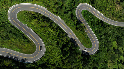 aerial view ROAD No.1081 of winding mountain road between Pua Ddistric, Nan Province, Thailand is...