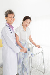 doctor explaining to female patient about how to use walker, walk training and rehabilitation process 