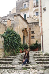 Fototapeta na wymiar Demure pose of a woman, Matera, Italy
