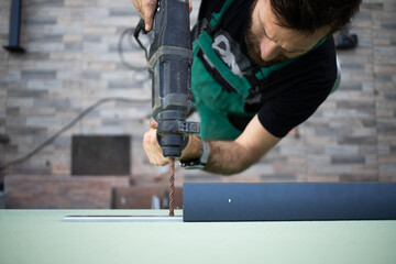 construction worker installing terrace roof on house