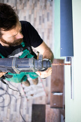 construction worker installing terrace roof on house