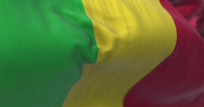 Close-up view of the Mali national flag waving in the wind