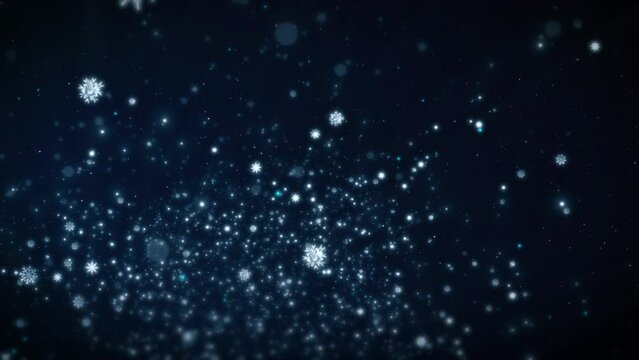 Festive Christmas background with flying snowflakes and shimmering particles.