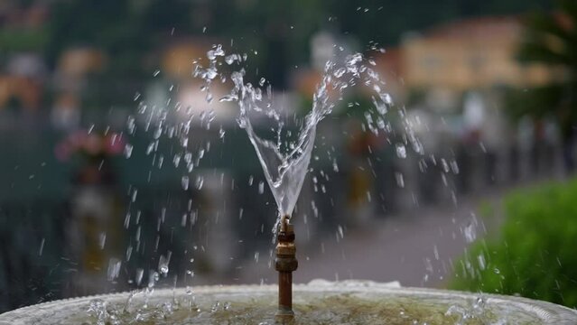 Slow motion video of a public drinking water fountain.