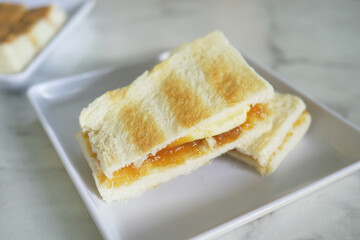 kaya toast with a cup of tea on table 