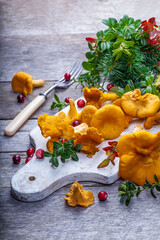 Raw wild mushrooms chanterelles on old wooden background. Vegetarian healthy product. Healthy lifestyle. - 544668178