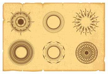 A set of monochrome symbols of the sun on old yellow parchment